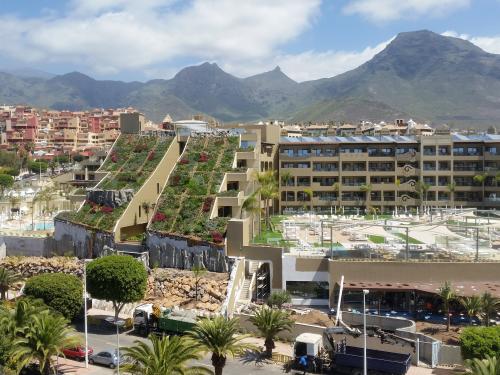 Large building with steep pitched green roof